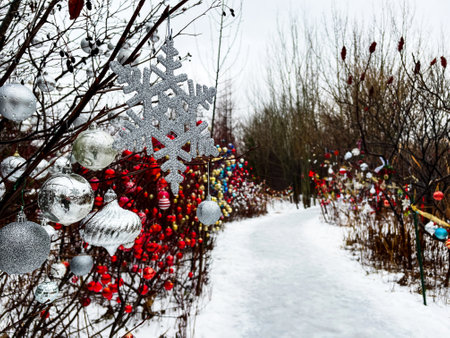 Christmas decorations in the park. Winter landscape with snowflakes.の写真素材