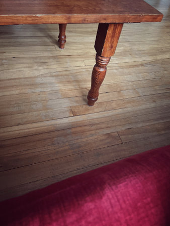 Wooden table and sofa on the wooden floor in the room.の写真素材