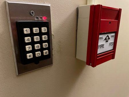 Fire alarm system on the wall in the building. Red fire alarm.