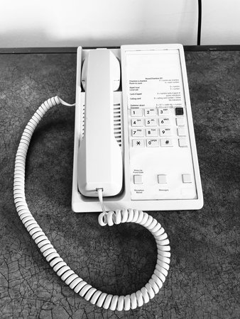 White telephone on the table in black and white tone, black and white tone
