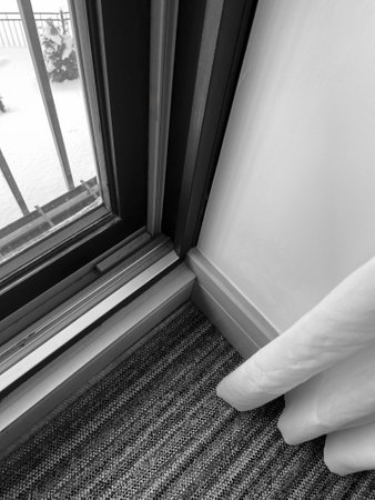 Black and white image of a window with curtains and blinds.の写真素材
