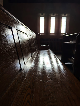 Wooden bench in a church, detail of the interior of the church