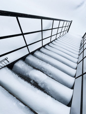 staircase in the snow in winter, closeup of photoの写真素材