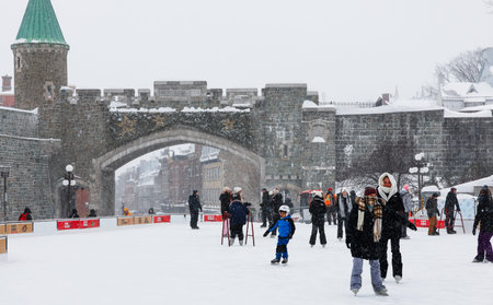 People ice skating at the old town of Quebec city.のeditorial素材