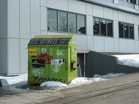 Green bin in winter in Quebec city.