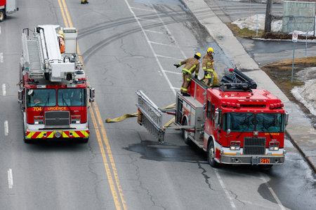 Firefighters extinguish a fire on a road in the Quebec city. Quebec City firefighters on call for a...