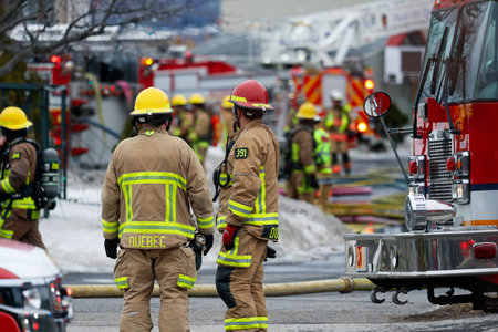 Firefighters and emergency vehicles on the streets of the city during a fire drill. Quebec City...