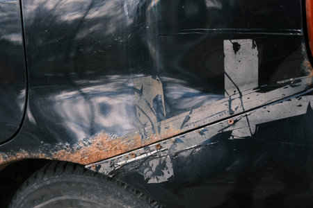 Close-up of a rust-damaged car.の写真素材