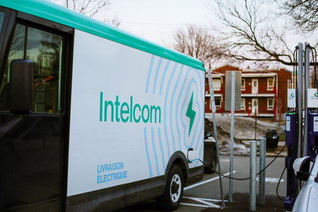 An electric delivery truck from Intelcom has an electric vehicle charging station in Quebec City.のeditorial素材