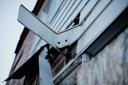 Broken roof of an old house, close-up. Damaged roofの写真素材