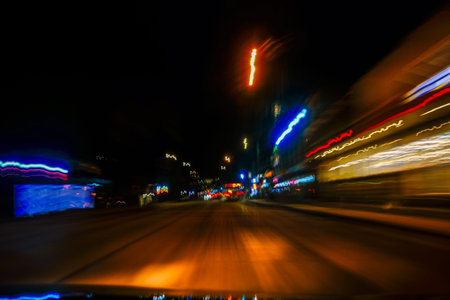 The car on the road in the city at night with motion blur
