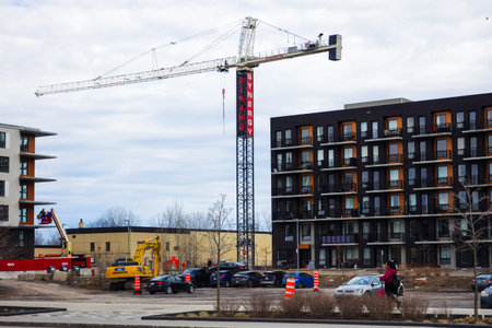 Construction of a new residential complex. Tower crane and building under construction on the...