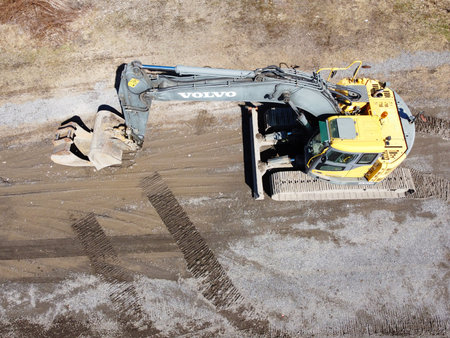 Excavator at the construction site. Volvo machinery on a new construction site.