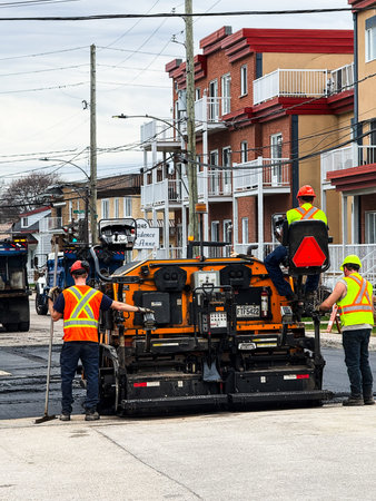 Quebec City road workers. Repairing a road.