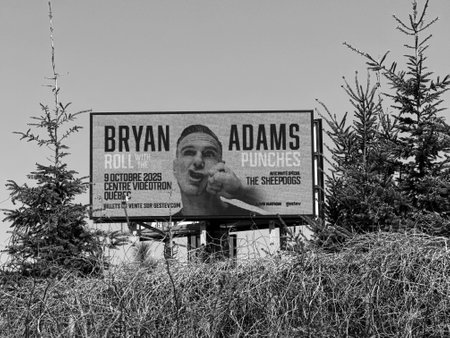Highway sign advertising the Roll with the Punches show by Canadian singer Bryan Adams in Quebec.のeditorial素材