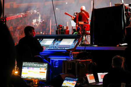 Sound technician at a music show. Backstage view.