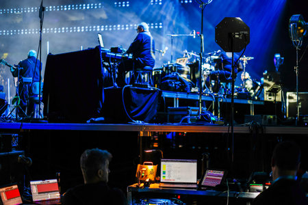 Sound technician at a music show. Backstage view.