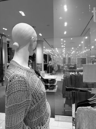 Black and white photo of a mannequin in a shopping mallの写真素材