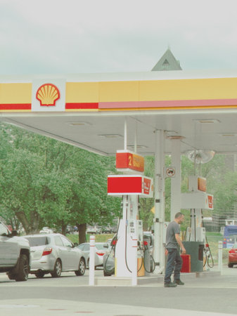 Petrol station Shell with gas pump and refueling car, retro styleのeditorial素材