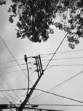 Electricity post on a cloudy day. Black and white photos.の写真素材