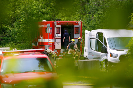 Firefighters and emergency vehicles at a training site.
