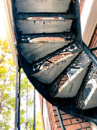 spiral staircase in front of a building, closeup of photoの写真素材