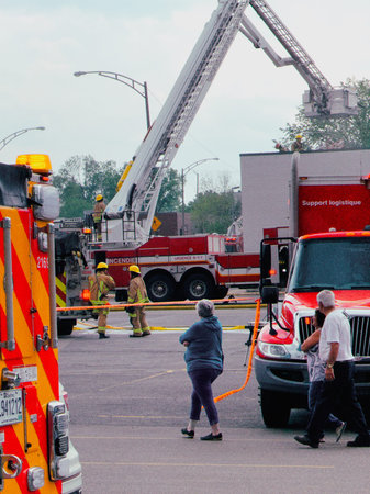 Firefighters respond to a fire in Quebec City. Fire trucks and vehicles in Quebec City. SPCIQ in...