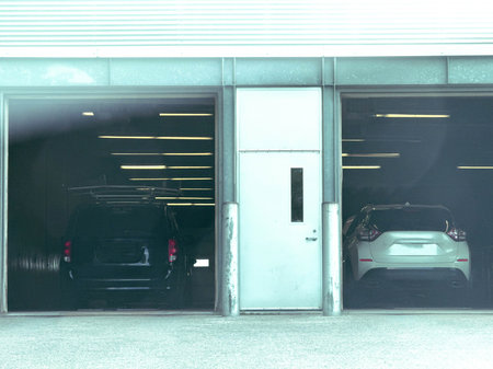Auto mechanic repairing a car in a garage.の写真素材