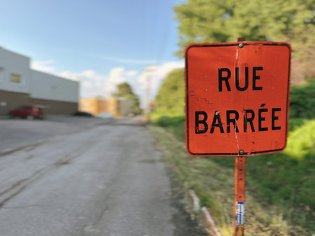 A road sign with the words Rue BarrÃ©e written on it in French.の写真素材
