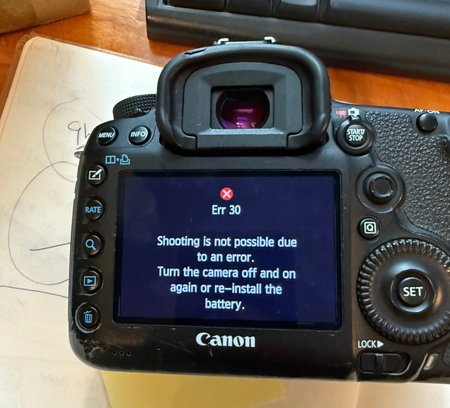 Close-up of a Canon EOS 5d camera error. Canon Err. 30 Shooting is not possible.