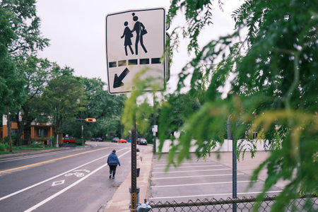 Traffic sign for a pedestrian crossing on a city street in a school zone.の写真素材