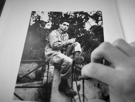 Portrait in a book by photographer Robert Capa. Black and white photos.