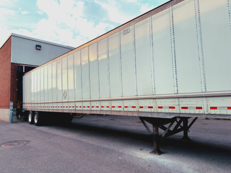 Container truck arrives at the warehouse for unloading.