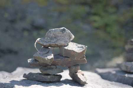 Pile of stones on top of a mountain, shallow depth of field