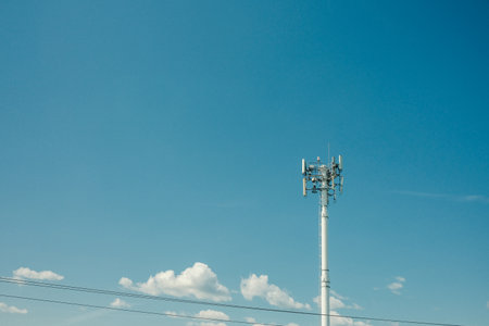 Telecommunication tower on blue sky background. Technology and communication concept.の写真素材