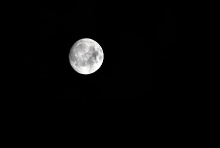 Full moon in the dark night sky.の写真素材