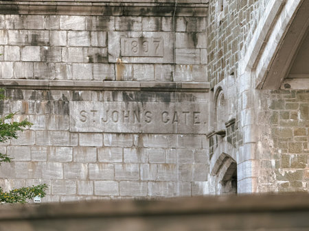 People walk along St-Jean Street in Old Quebec City. St. John's Gate in Quebec city.