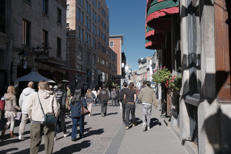 Tourists in the tourist and cultural heart of Old Montreal. View of the street in Montreal, Quebec.のeditorial素材