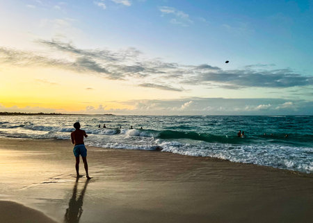 silhouette of a man on the beach at sunset in Playa Bavaro in Punta Cana, Dominican Republic