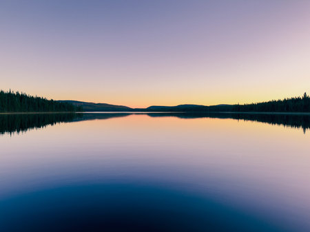 A lake at sunset in the forest. Quebec, Canada.の写真素材