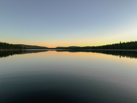 A lake at sunset in the forest. Quebec, Canada.の写真素材
