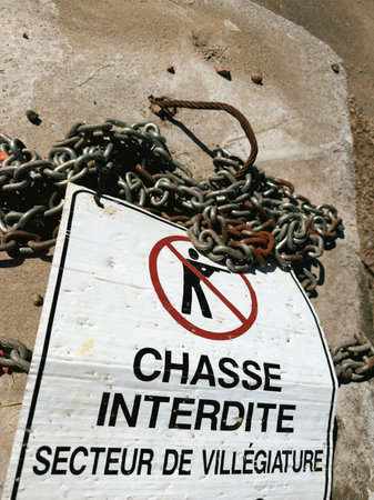 A sign warning of hunting being prohibited in a resort area written in French.の写真素材