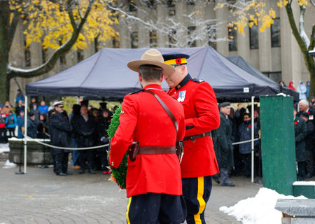 People at the Memorial in Quebec city. The memorial is dedicated to those who died in World War II....
