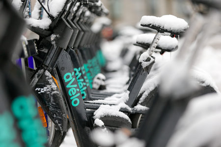 Bicycles covered with snow in Quebec city. Quebec City, Canada. Electric bike sharing service at...