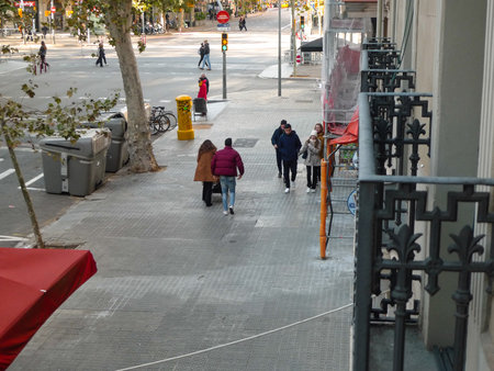 Street view of Barcelona, Spain. Unidentified people walking on street in Barcelona, Spain. People on the streets of Barcelona, Spain.のeditorial素材