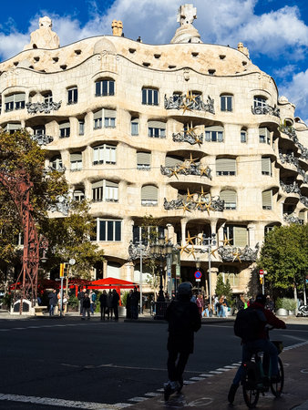 Casa Mila, Spanish, popularly known as La Pedrera, Spanish in reference to its unconventional...