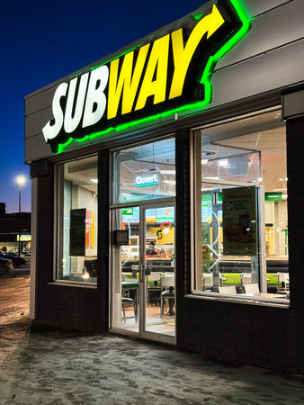 Facade of a Subway restaurant in Quebec City at night.のeditorial素材