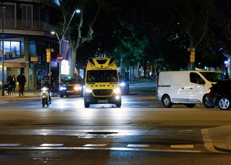 Ambulance in the streets of Barcelona, ââââSpain. Ambulance in Barcelona at nightのeditorial素材