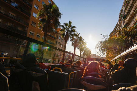 Barcelona tourist buses. Double-decker buses in Barcelona. Tourists on a bus in Barcelona, Spain. View of the street in Barcelona, Spainのeditorial素材