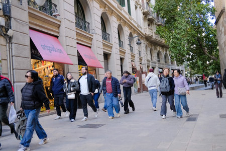 Unidentified people in the streets of Barcelona. Barcelona is the capital and the most populous city of Catalonia.のeditorial素材